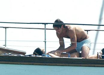 Manuela Arcuri sunbathing topless on a yacht