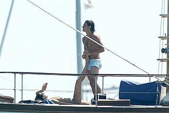 Manuela Arcuri sunbathing topless on a yacht