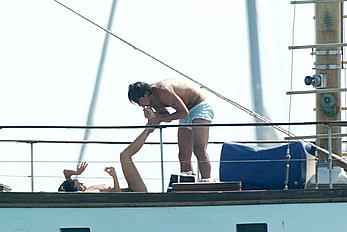 Manuela Arcuri sunbathing topless on a yacht