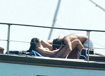 Manuela Arcuri sunbathing topless on a yacht