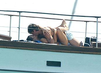 Manuela Arcuri sunbathing topless on a yacht