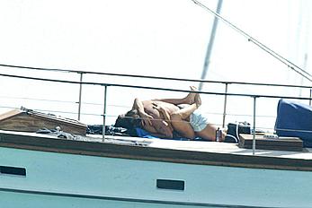 Manuela Arcuri sunbathing topless on a yacht