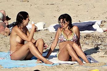 Penelope Cruz caught topless on the beach in Corsica