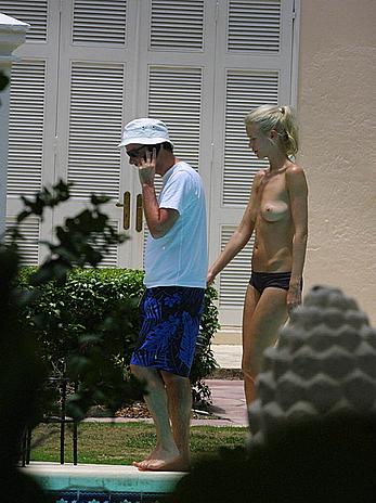 German supermodel Claudia Schiffer topless poolside paparazzi shots