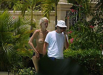 German supermodel Claudia Schiffer topless poolside paparazzi shots