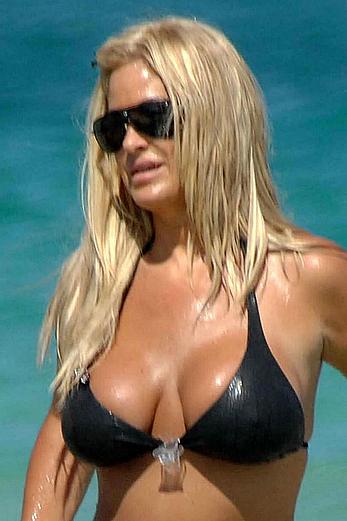 Kim Zolciak deep cleavage in black bikini