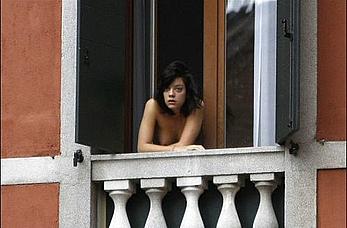 Lily Allen topless on a balcony