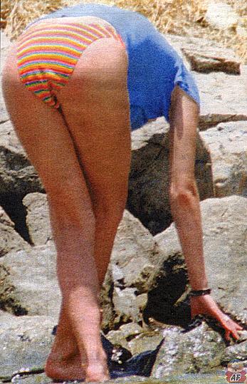 Zoe Ball caught topless on the beach